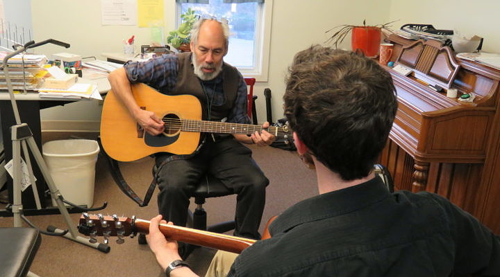 Guitar student working with UVMC faculty Tristan Bellerive