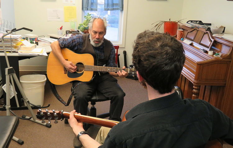 Guitar student working with UVMC faculty Tristan Bellerive