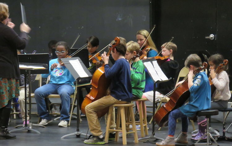 young students perform in an orchestra