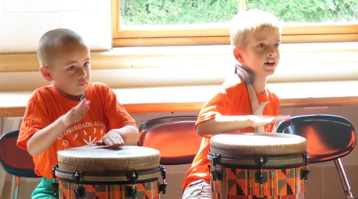 Campers discover music through drumming.