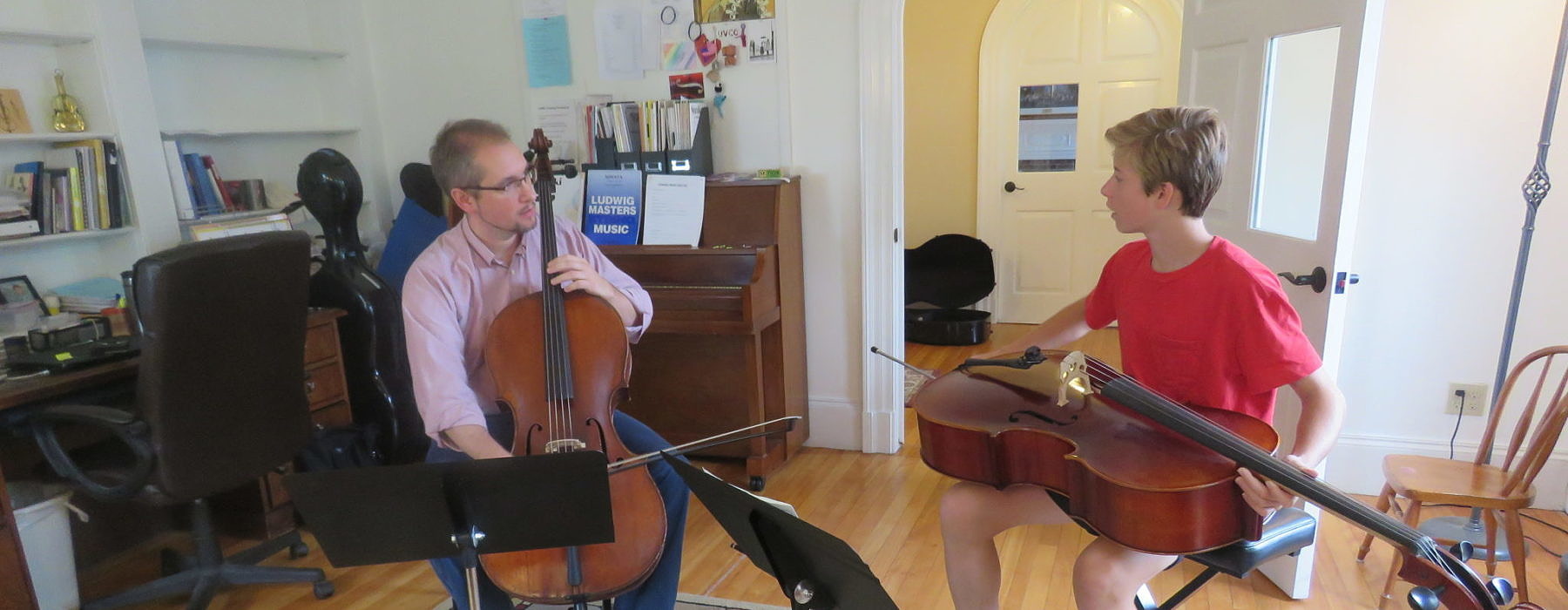 Ben Kulp teaches a cello lesson