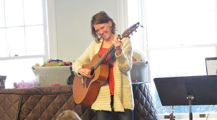 Brooke Wilkinson plays guitar at the Music Together Faculty Concert