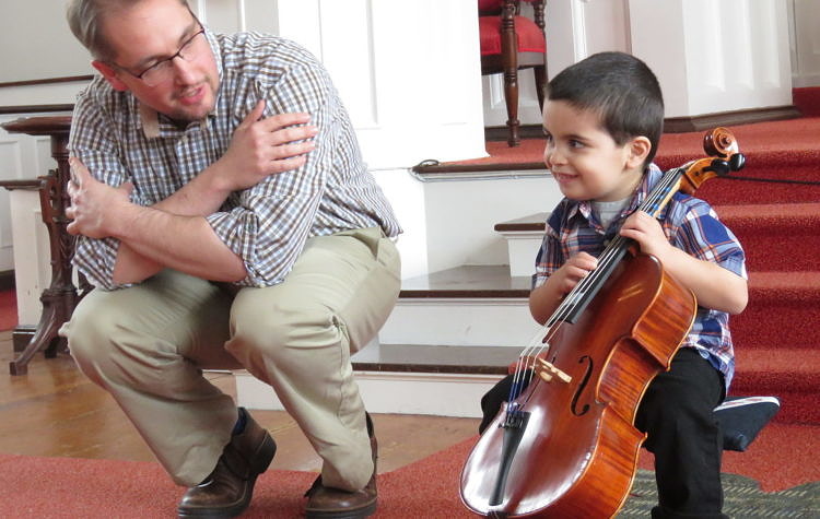 teacher and student with cello