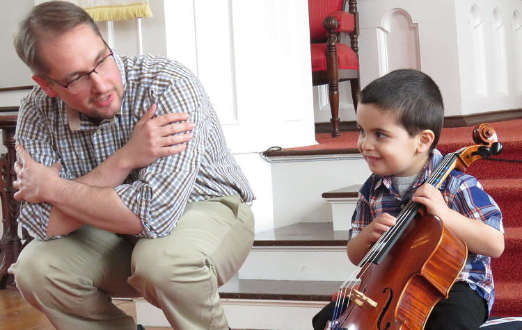 teacher and student with cello