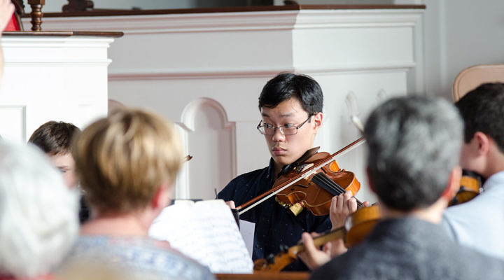 violin student performing with instructor