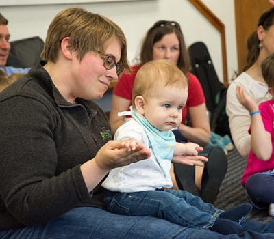 Mother and baby playing together in music class
