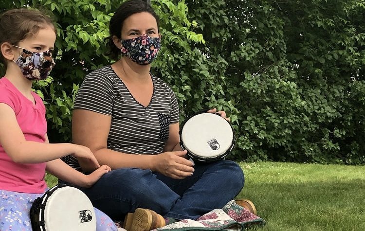 mother and child playing drum