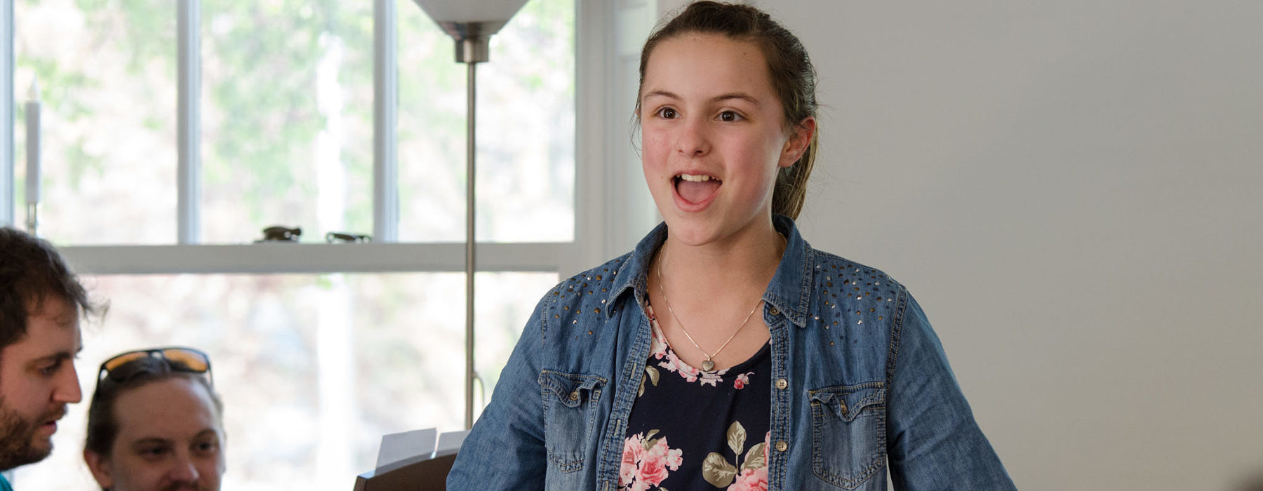 VOice student performing with a big smile