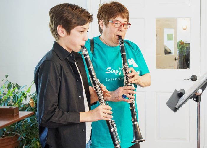 Clarinet student and teacher performing together