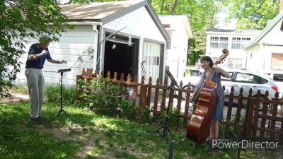 Mark Nelson conducts a bass in the yard