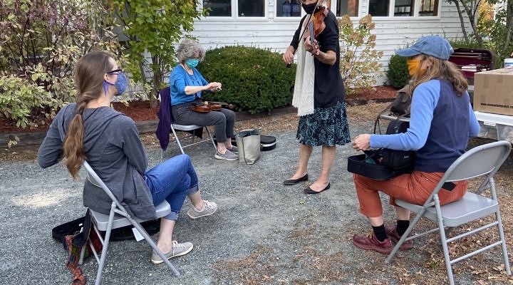 Fiddlers enjoying a traditional tune.
