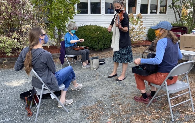 Fiddlers enjoying a traditional tune.