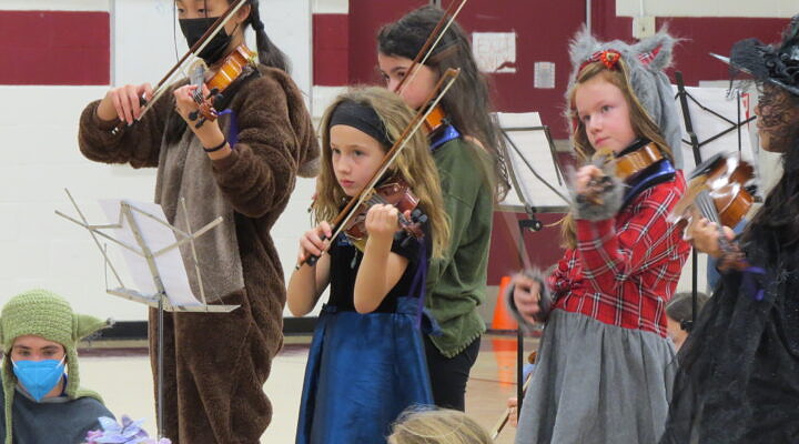 kids in costumes with instruments