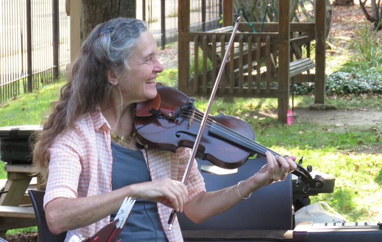 Fiddle students listening to a new tune.