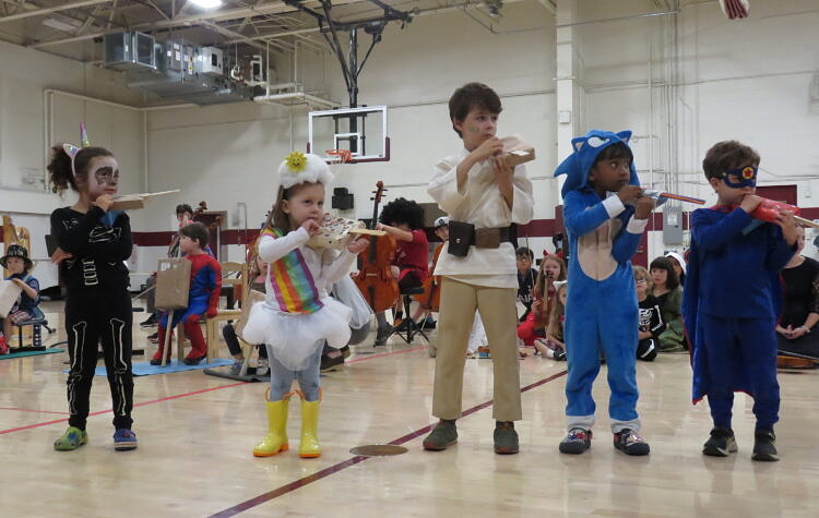 kids in costumes with instruments