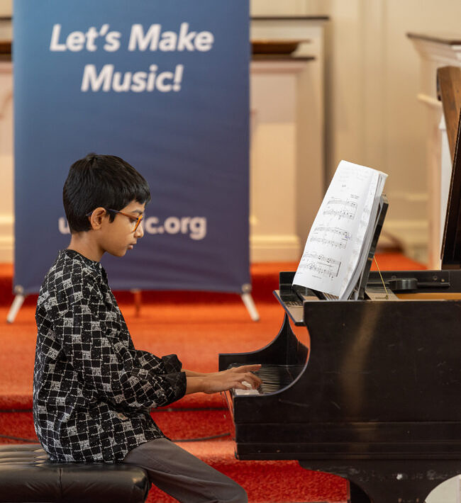 student at the piano